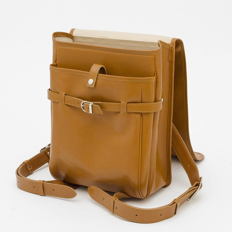 Brown leather backpack with a strap on a white background