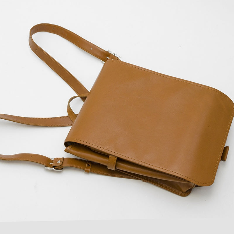 Brown leather bag on a white background