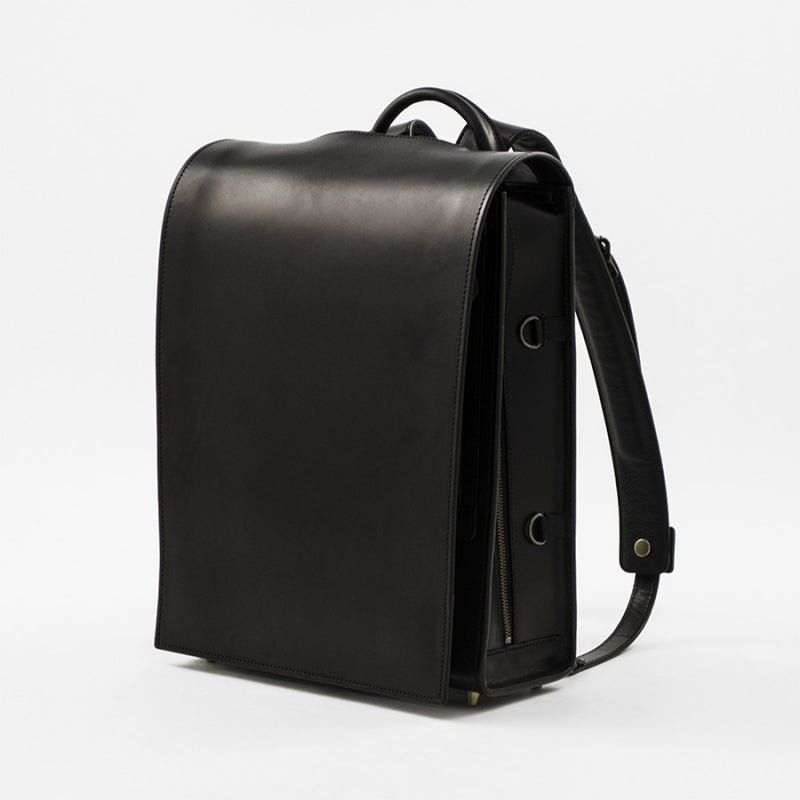 Black leather backpack on a white background